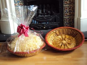 DIY Hamper kit containing Round wicker deli basket tray, cellophane basket bag, RED pull bow and paper shred