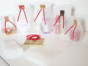Pack of 20  Small clear frosted block bottom sweet/party/ gift bags (3" x 2" x 7") with assorted "just for you" sticky labels and red satin ribbon