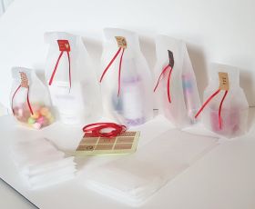Pack of 20  large clear frosted block bottom sweet/party/ gift bags (4" x 2 1/2" x 9 3/4") with assorted "just for you" sticky labels and red satin ribbon