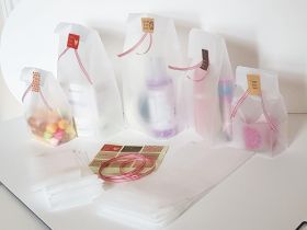 Pack of 20  large clear frosted block bottom sweet/party/ gift bags (4" x 2 1/2" x 9 3/4") with assorted "just for you" sticky labels and red/white cotton ribbon
