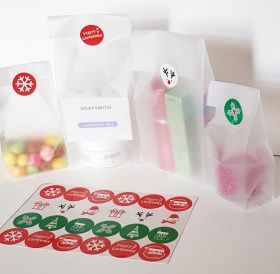 Pack of 20 Small clear frosted block bottom sweet/party/gift bags (3" x 2" x 7") with assorted printed Xmas symbols sticky labels